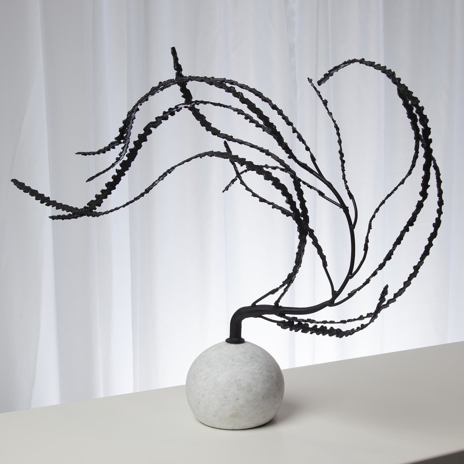 Thistle Sculpture by Global Views in black. Made from iron, white marble in a eclectic & global style.
