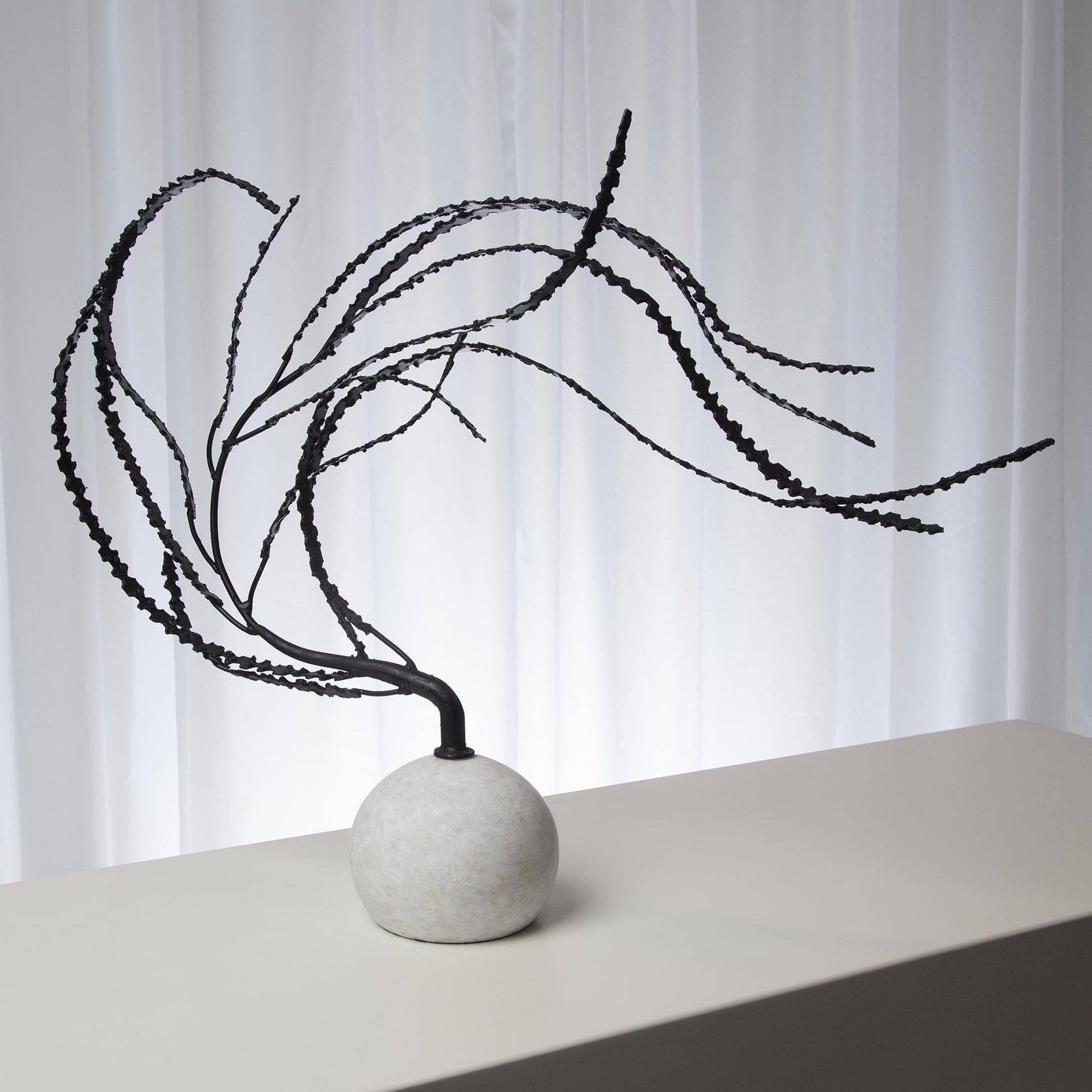 Thistle Sculpture by Global Views in black. Made from iron, white marble in a eclectic & global style.