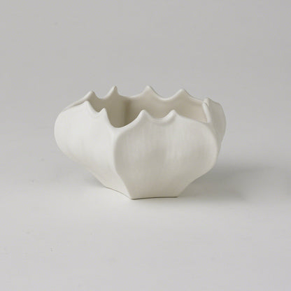 Star Fruit Bowl by Global Views. Made from ceramic in a coastal style.