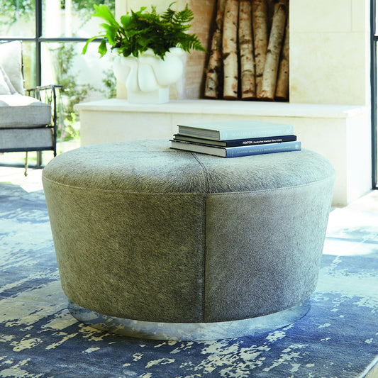 Tapered Ottoman by Global Views in nickel. Made from mdf, stainless steel, leather in a modern style.
