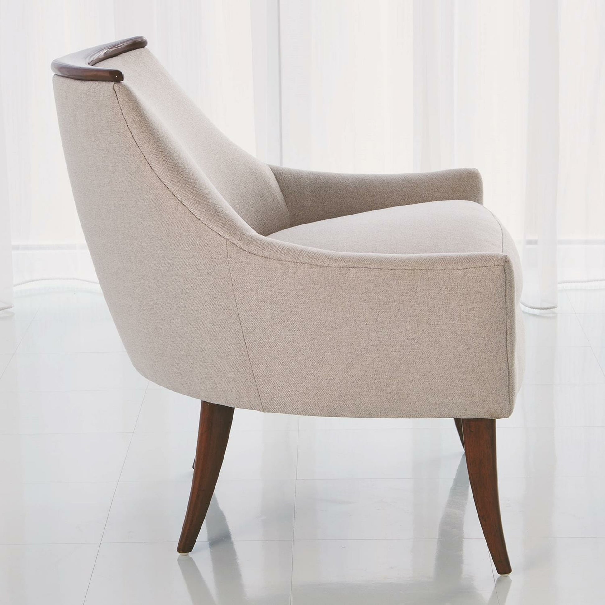 Boomerang Chair by Global Views in white leather. Made from rubberwood, ebony in a transitional style.