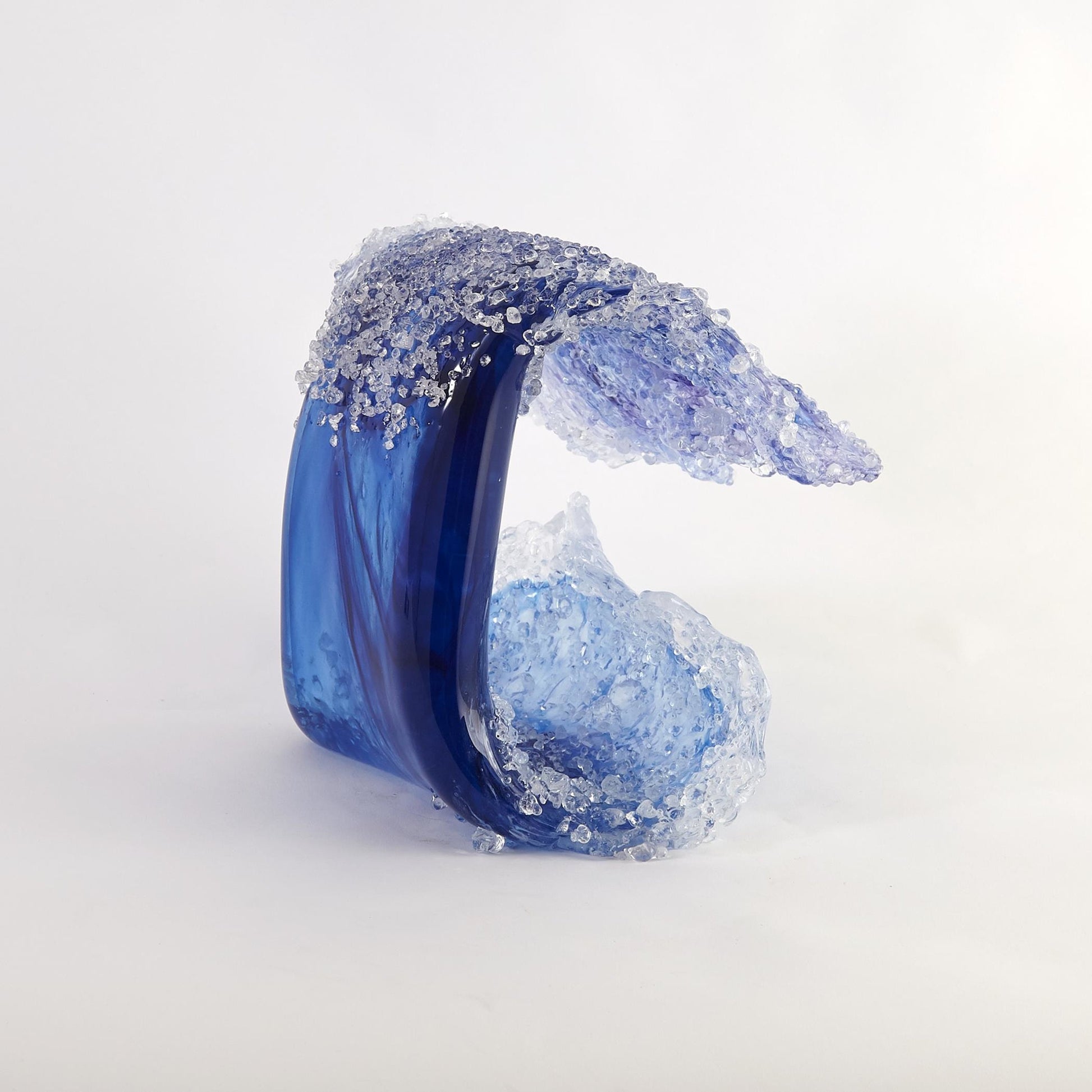 Tidal Wave Sculpture by Global Views. Made from art glass in a coastal style.