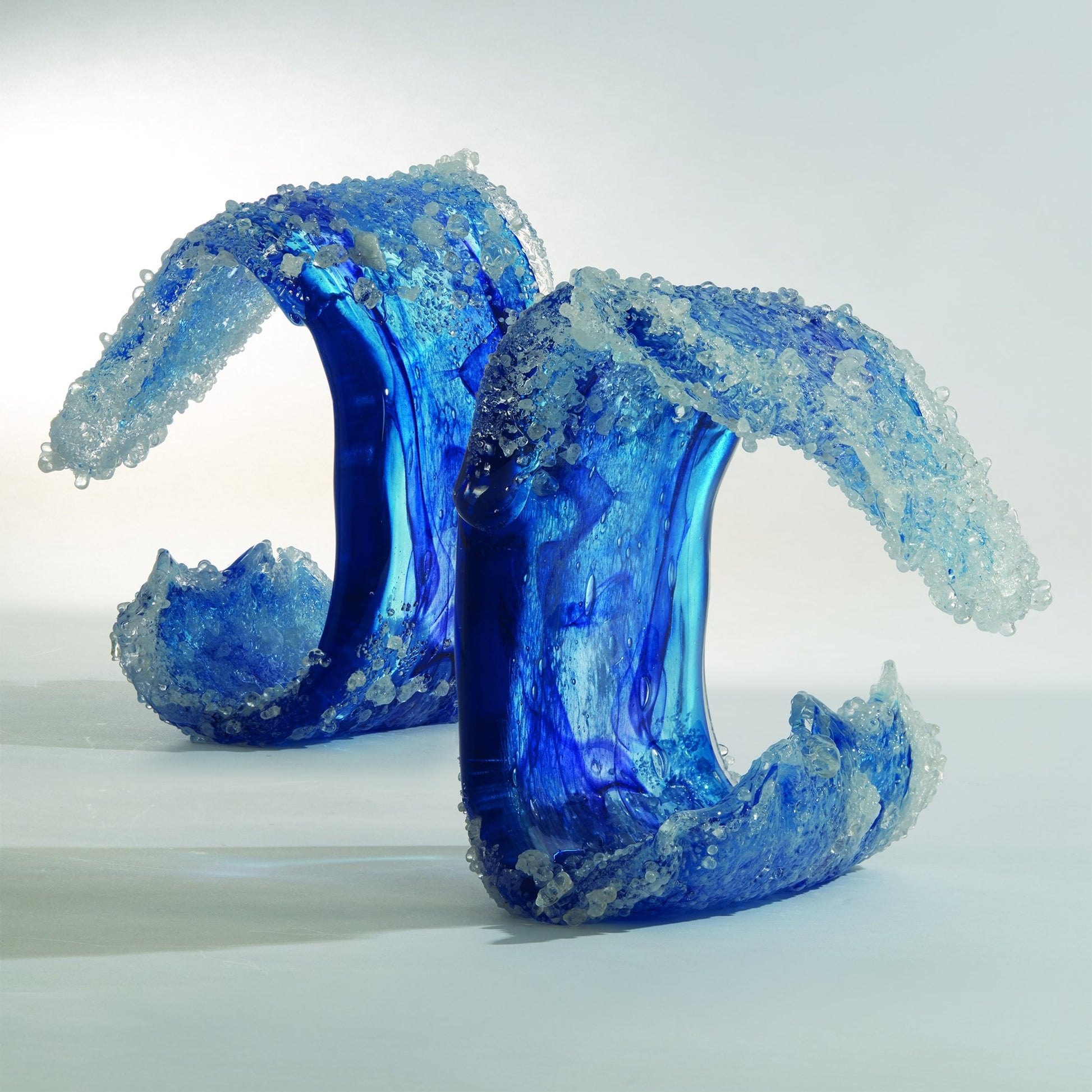 Tidal Wave Sculpture by Global Views. Made from art glass in a coastal style.