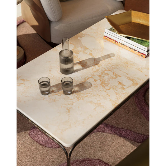 Crema Cocktail Table by Currey and Company in natural, bronze. Made from marble, iron in a modern style.