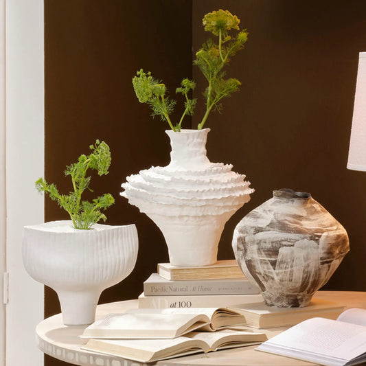 Ruffle Vase by Jamie Young in white and matte. Made from ceramic in a unique style.