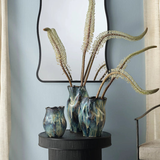 Whirl Vase by The Livingston Collection in blue and reactive blue glaze. Made from ceramic in a unique style.