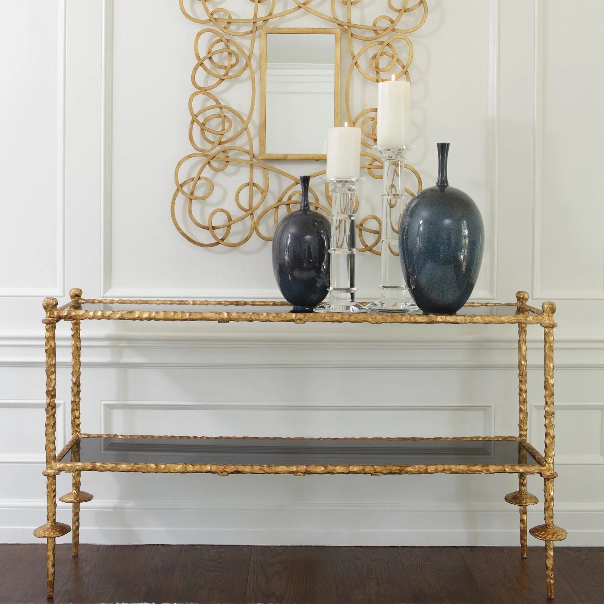 Chiseled Console by Global Views in gold leaf. Made from iron, polished black granite in a eclectic & global style.