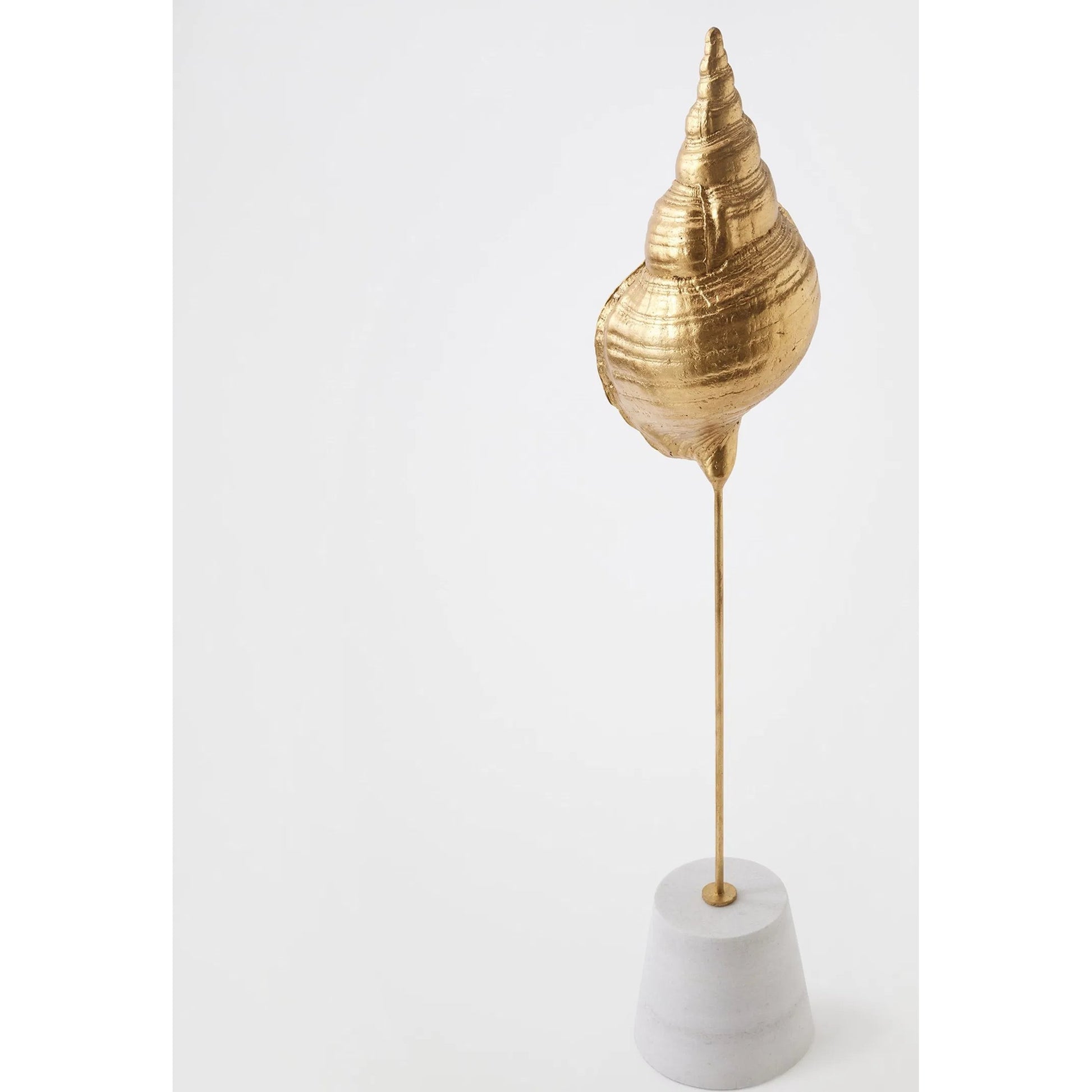 Shells on Marble by Global Views in miter, brass. Made from cast iron, white marble in a coastal style.