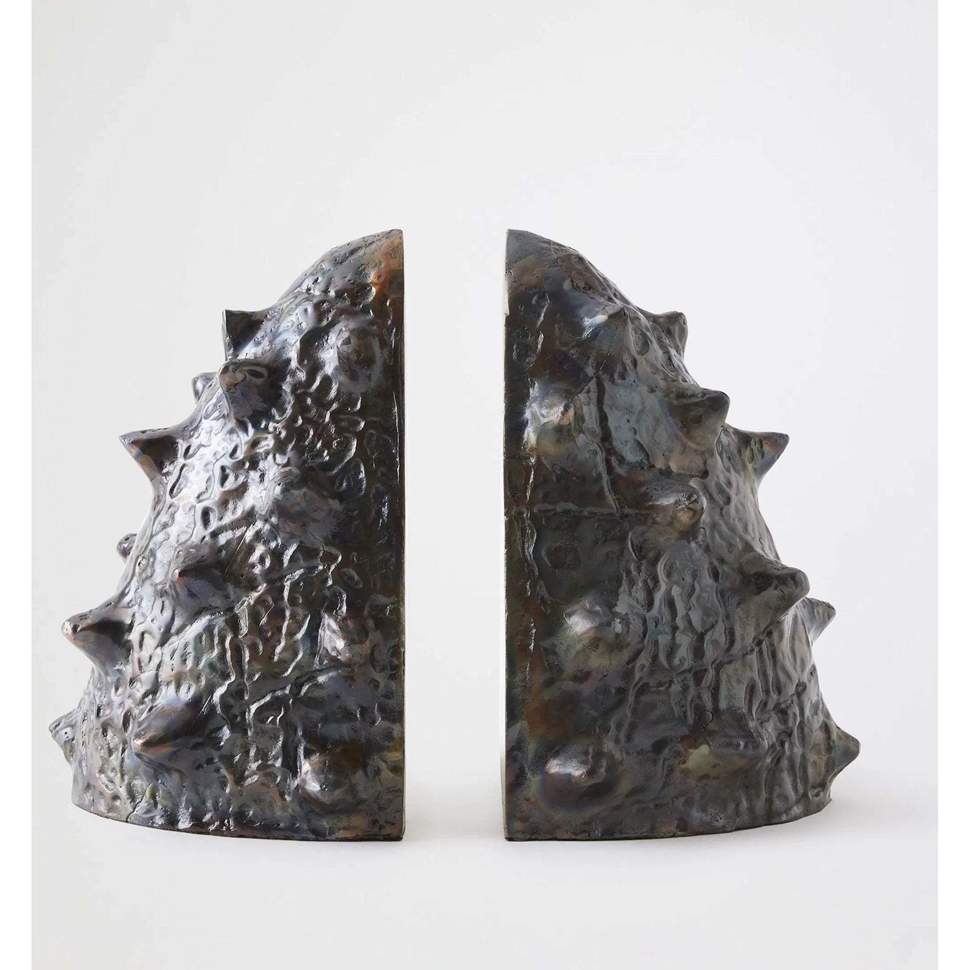 Biomorphic Bookends by Global Views in bronze, brass. Made from cast iron in a eclectic & global style.