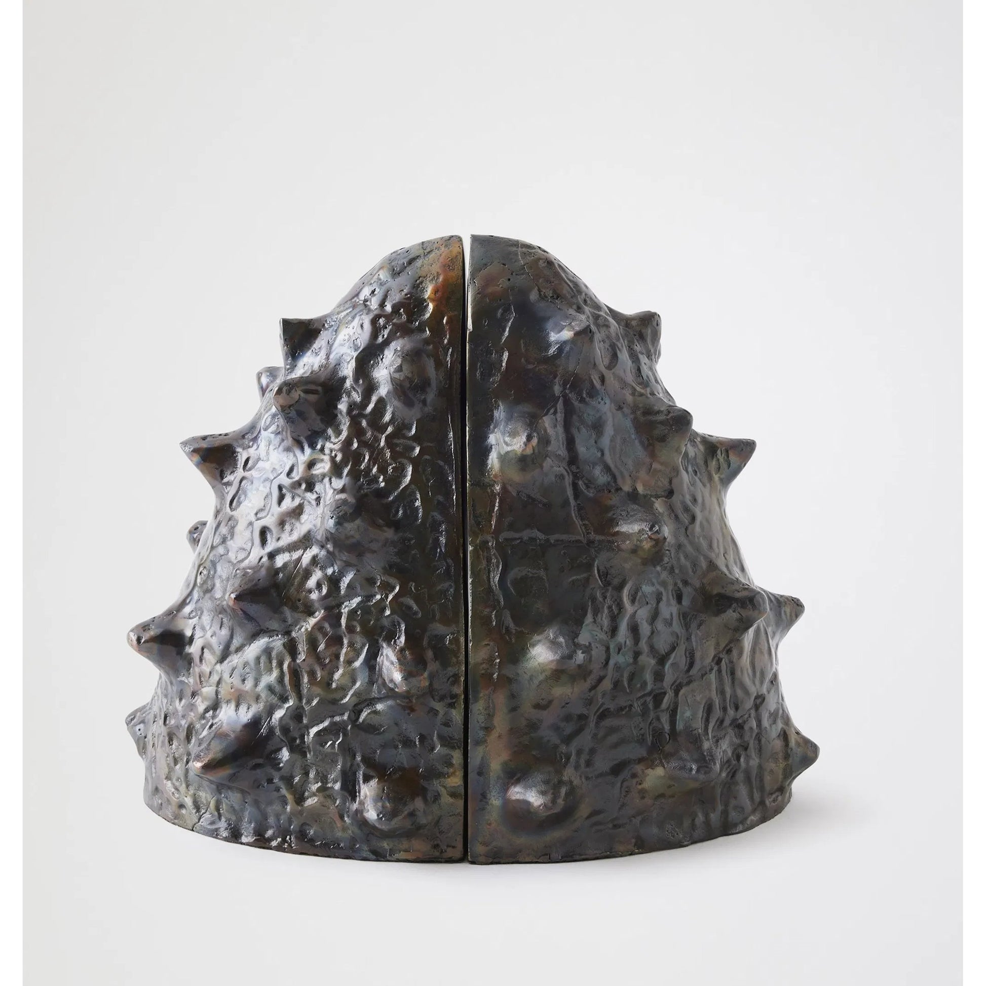 Biomorphic Bookends by Global Views in bronze, brass. Made from cast iron in a eclectic & global style.