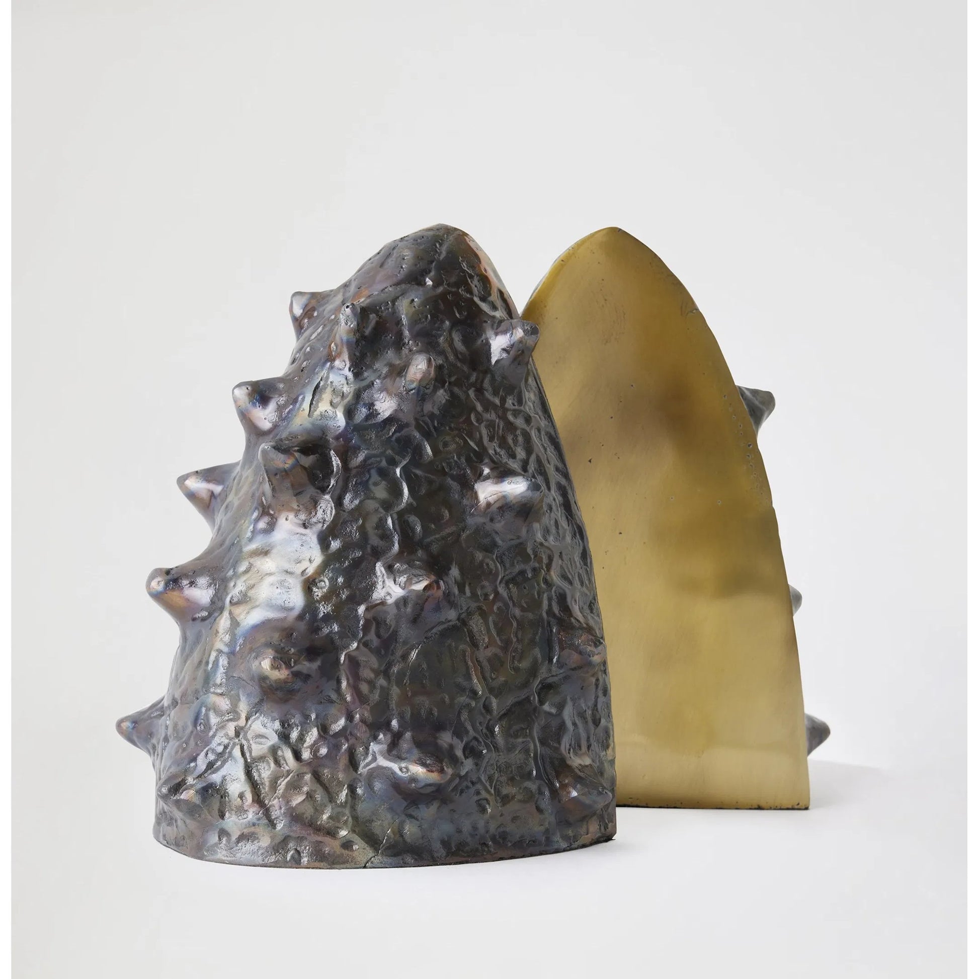 Biomorphic Bookends by Global Views in bronze, brass. Made from cast iron in a eclectic & global style.