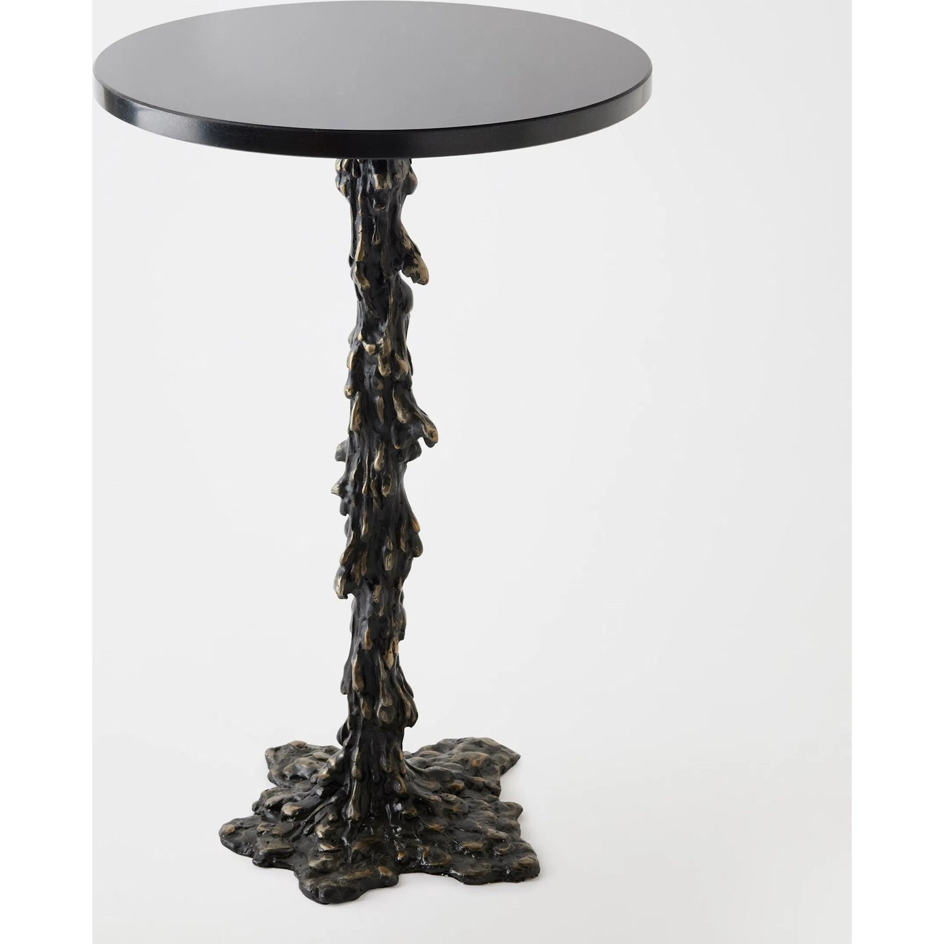 Melting Side Table by Global Views in black. Made from cast iron, granite in a rustic style.