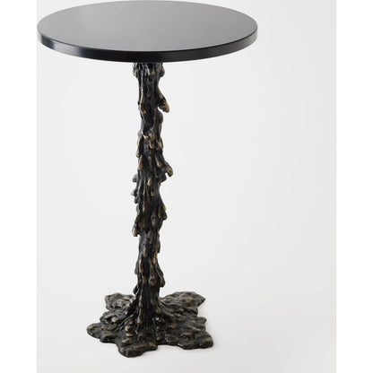 Melting Side Table by Global Views in black. Made from cast iron, granite in a rustic style.
