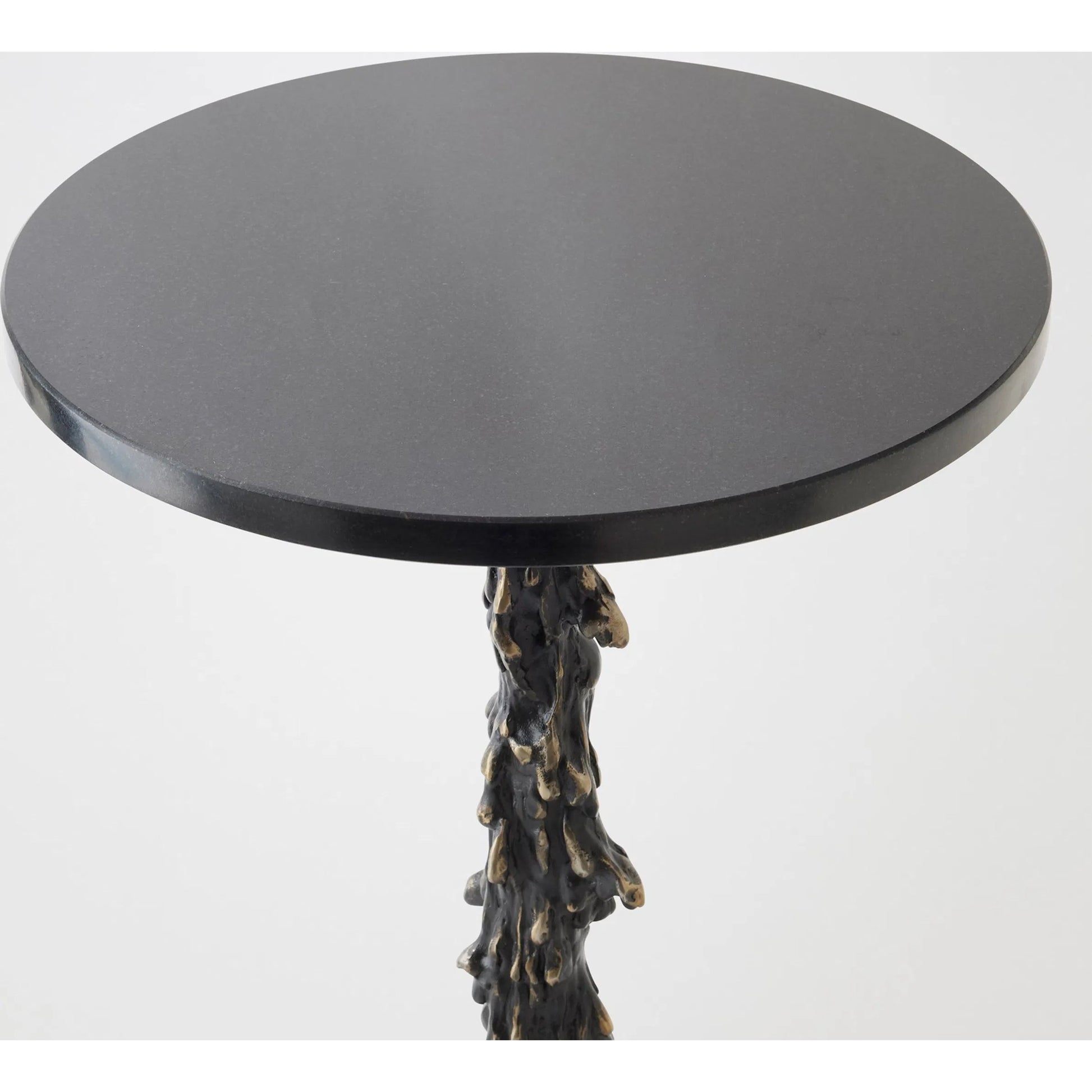 Melting Side Table by Global Views in black. Made from cast iron, granite in a rustic style.