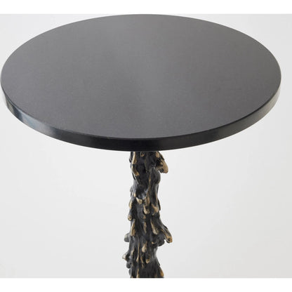 Melting Side Table by Global Views in black. Made from cast iron, granite in a rustic style.