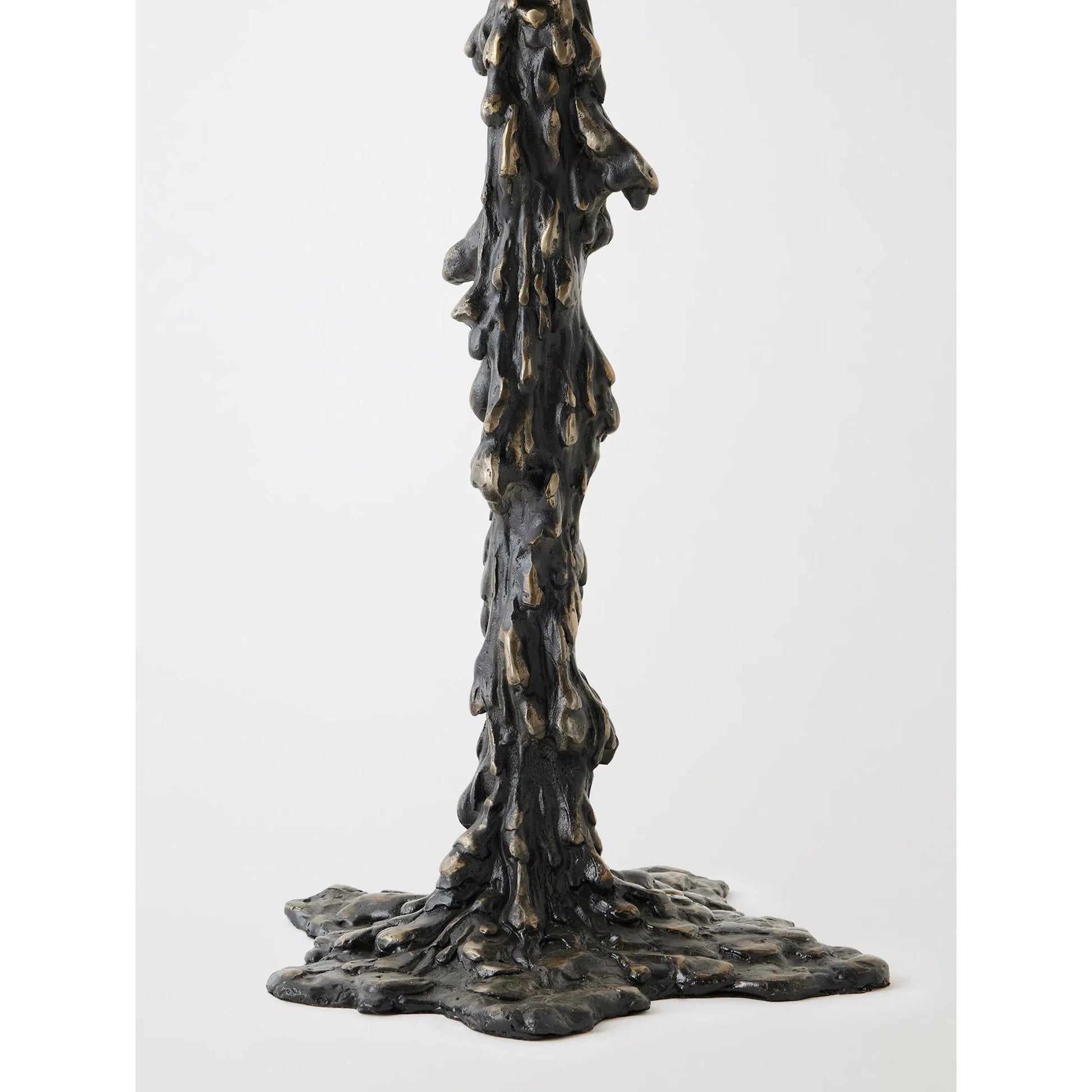 Melting Side Table by Global Views in black. Made from cast iron, granite in a rustic style.