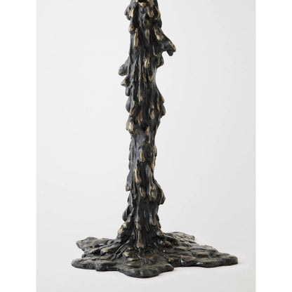 Melting Side Table by Global Views in black. Made from cast iron, granite in a rustic style.