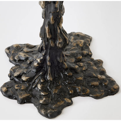 Melting Side Table by Global Views in black. Made from cast iron, granite in a rustic style.