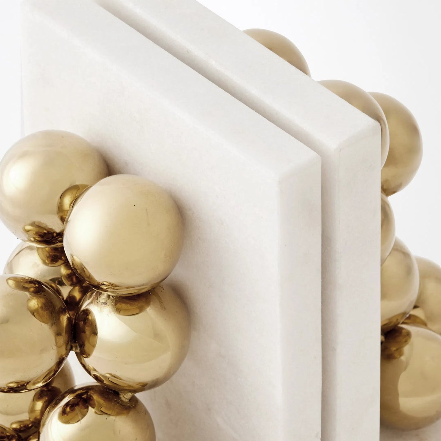 003 SI-2523887 | Closeup | Sphere Bookends by Global Views in brass. Made from faux gold ball, white marble in a modern style.