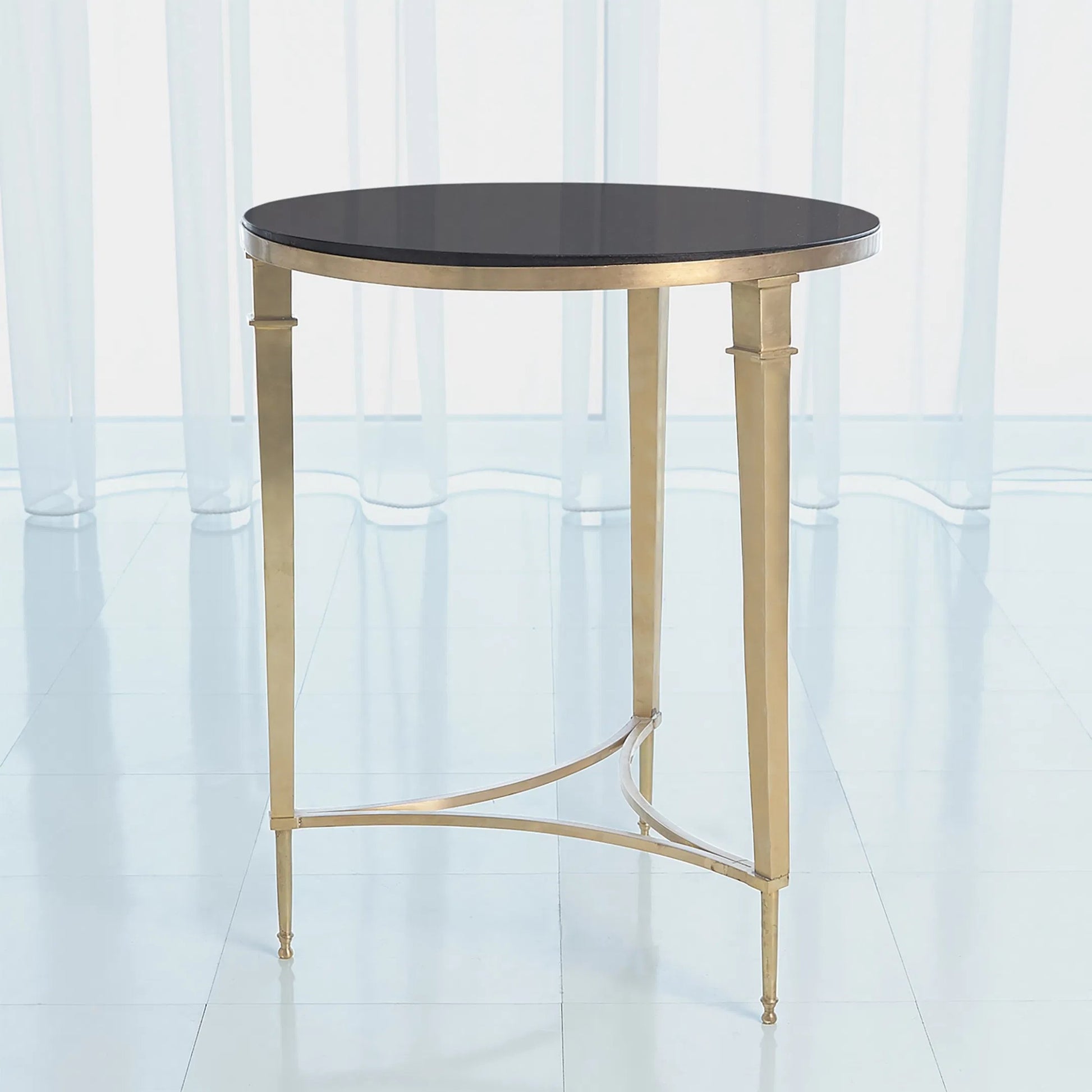 Round French Square Leg Table by Global Views in brass. Made from brass, granite in a transitional style.
