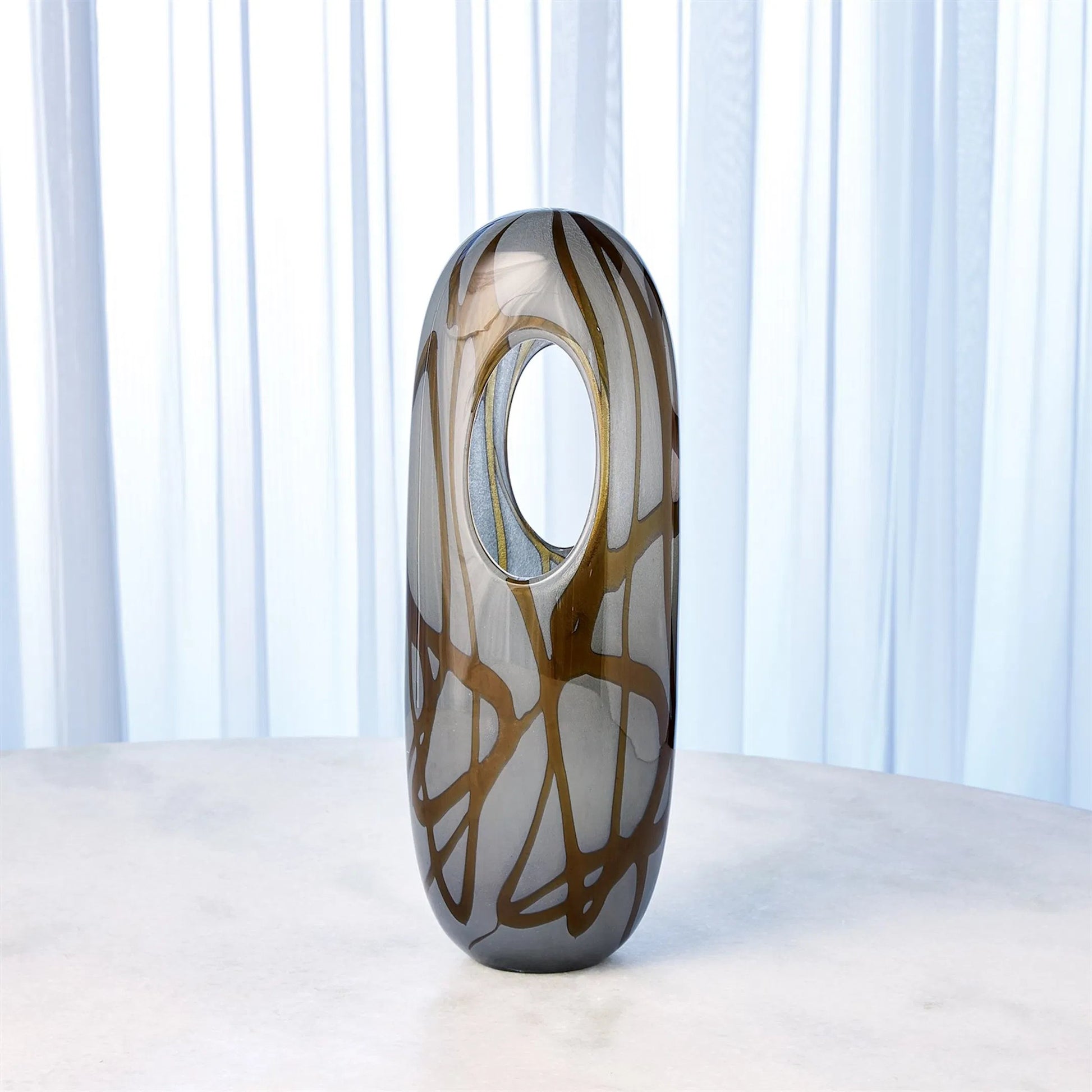Swirl Vase by Global Views in amber, gray. Made from art glass in a modern style.