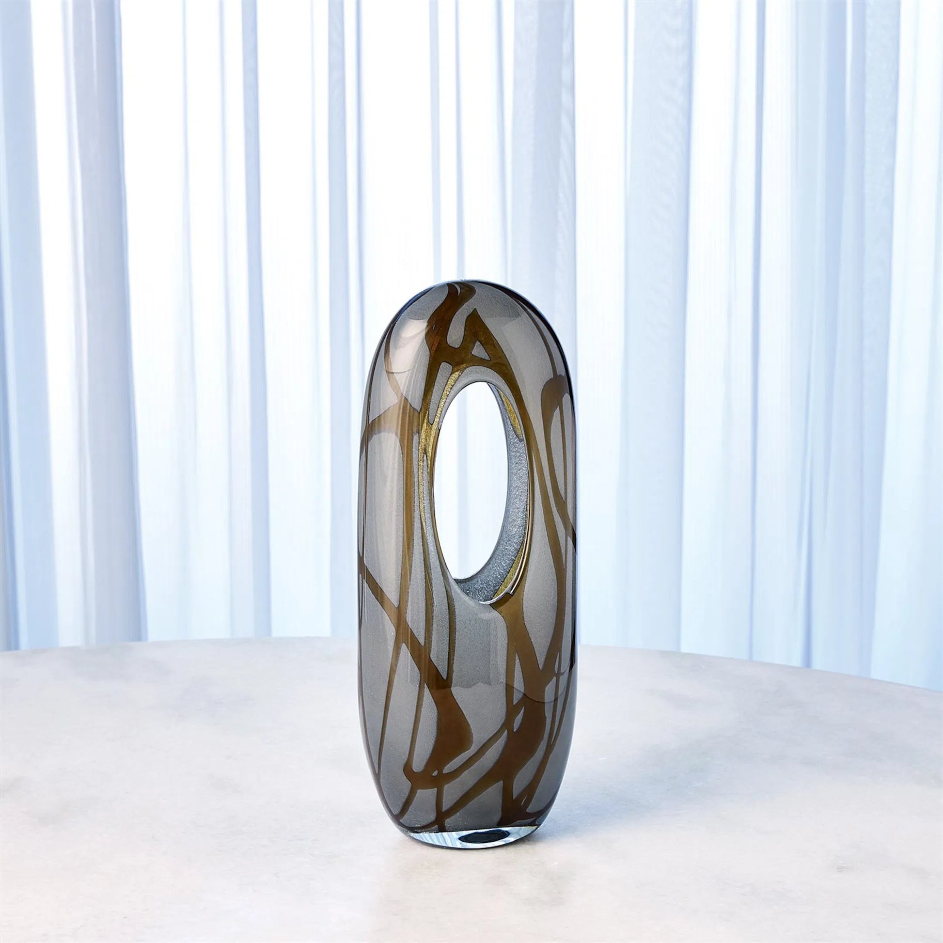 Swirl Vase by Global Views in amber, gray. Made from art glass in a modern style.