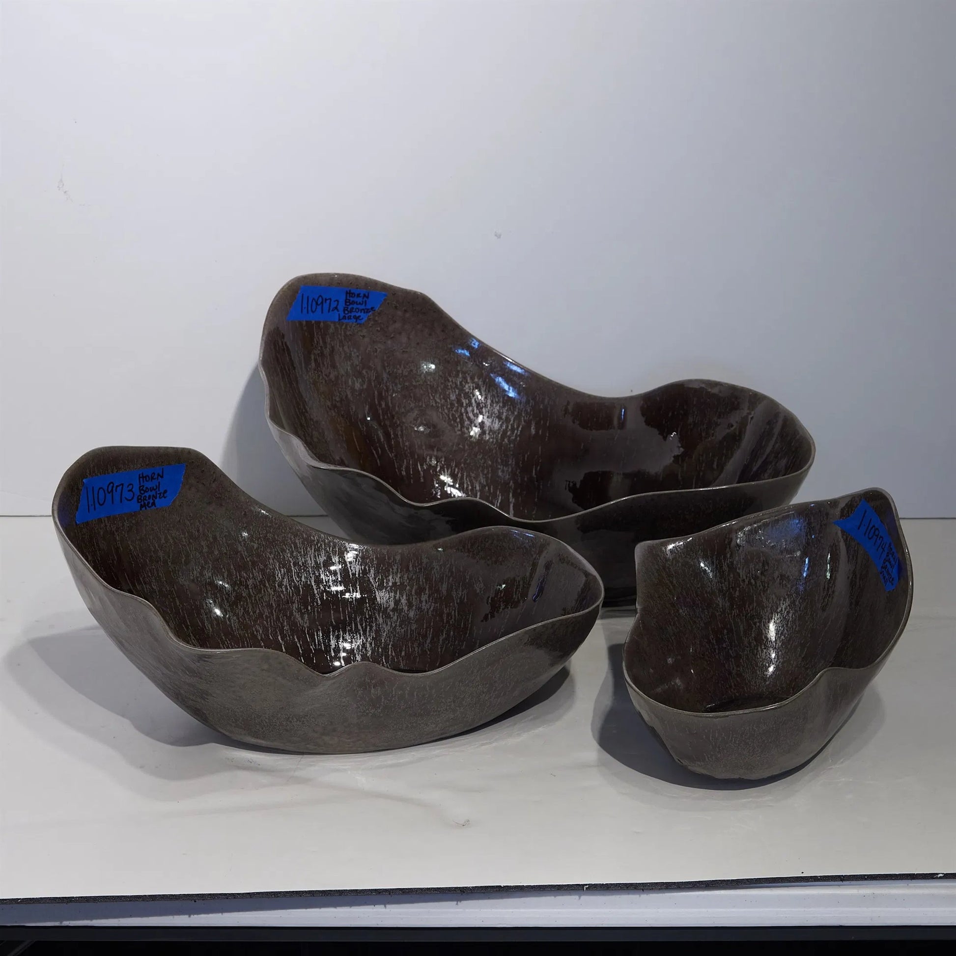 Horn Bowl, Reactive Amethyst by Global Views in reactive amethyst. Made from ceramic in a modern style.
