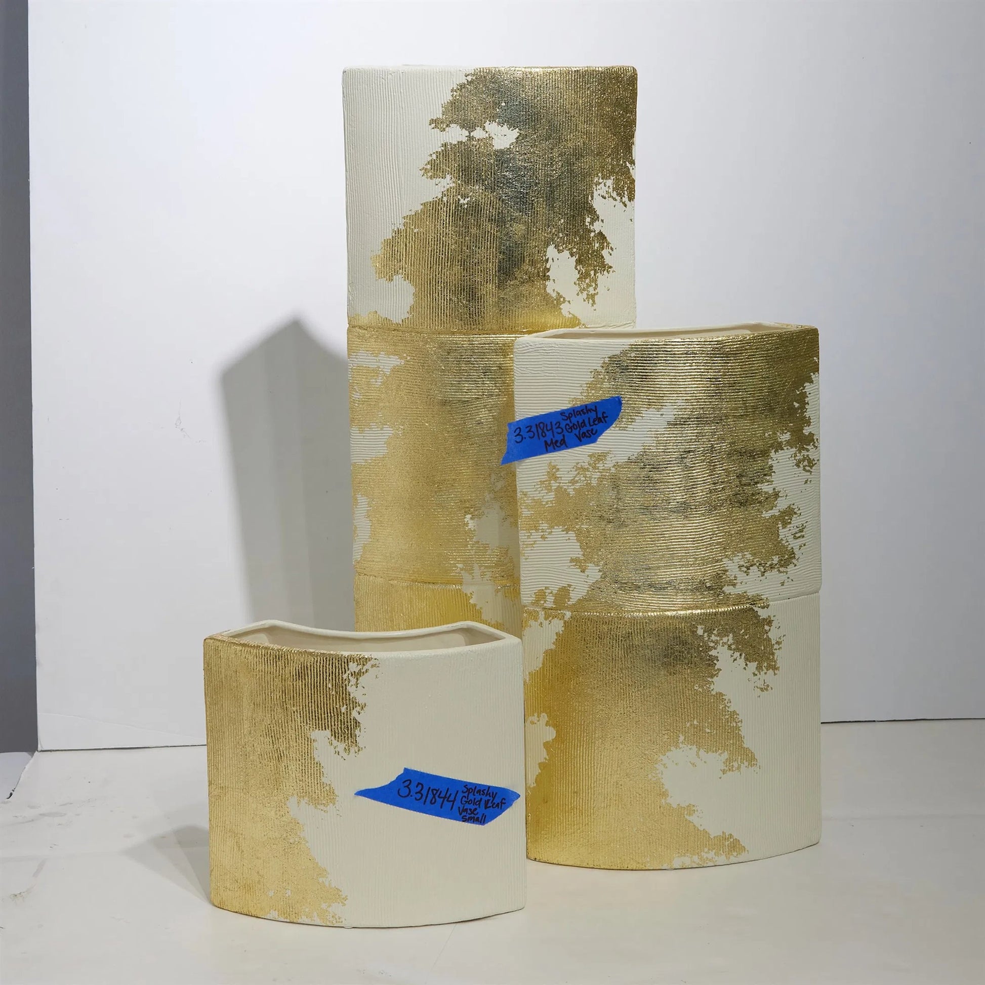Splashy Gold Leaf Vase by Global Views in natural. Made from ceramic in a unique style.