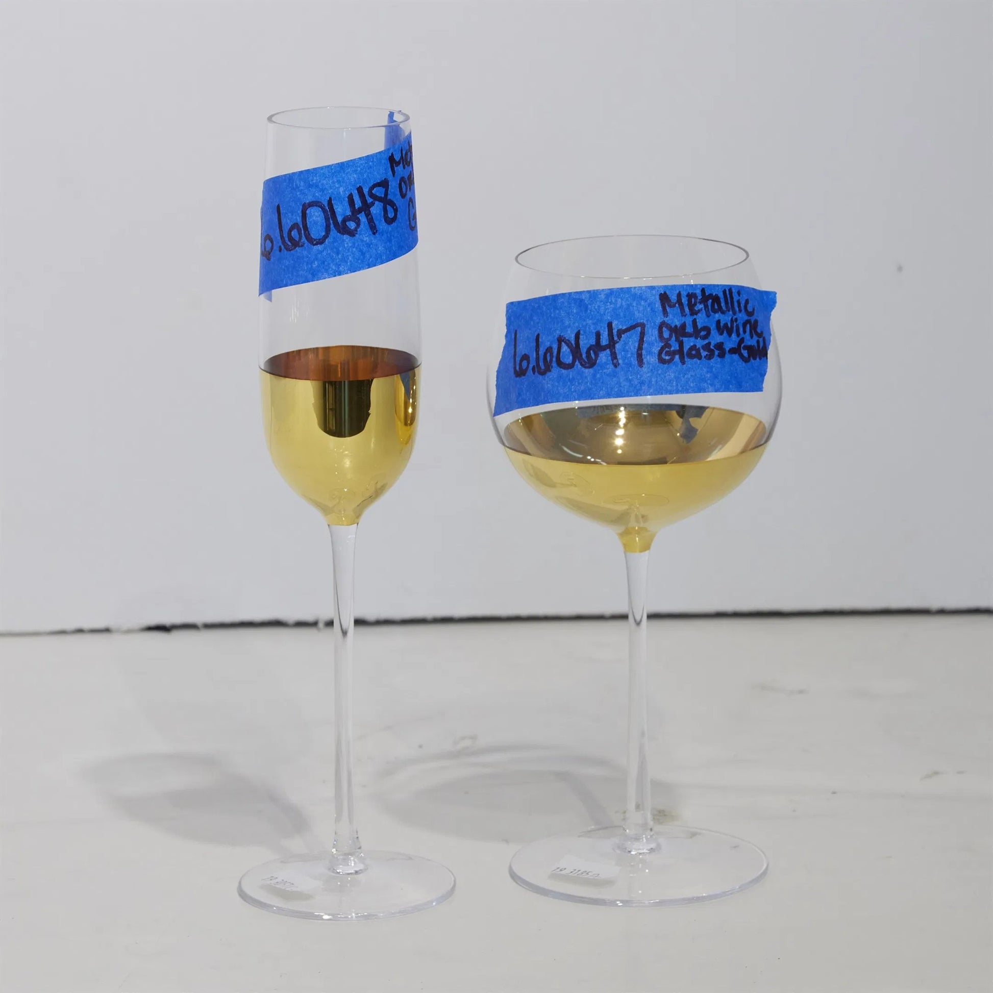 Metallic Orb Wine Glass by Global Views. Made from art glass in a eclectic & global style.