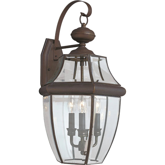 Lancaster Three Light Outdoor Wall Lantern by Visual Comfort & Co.. Made from brass in a unique style.