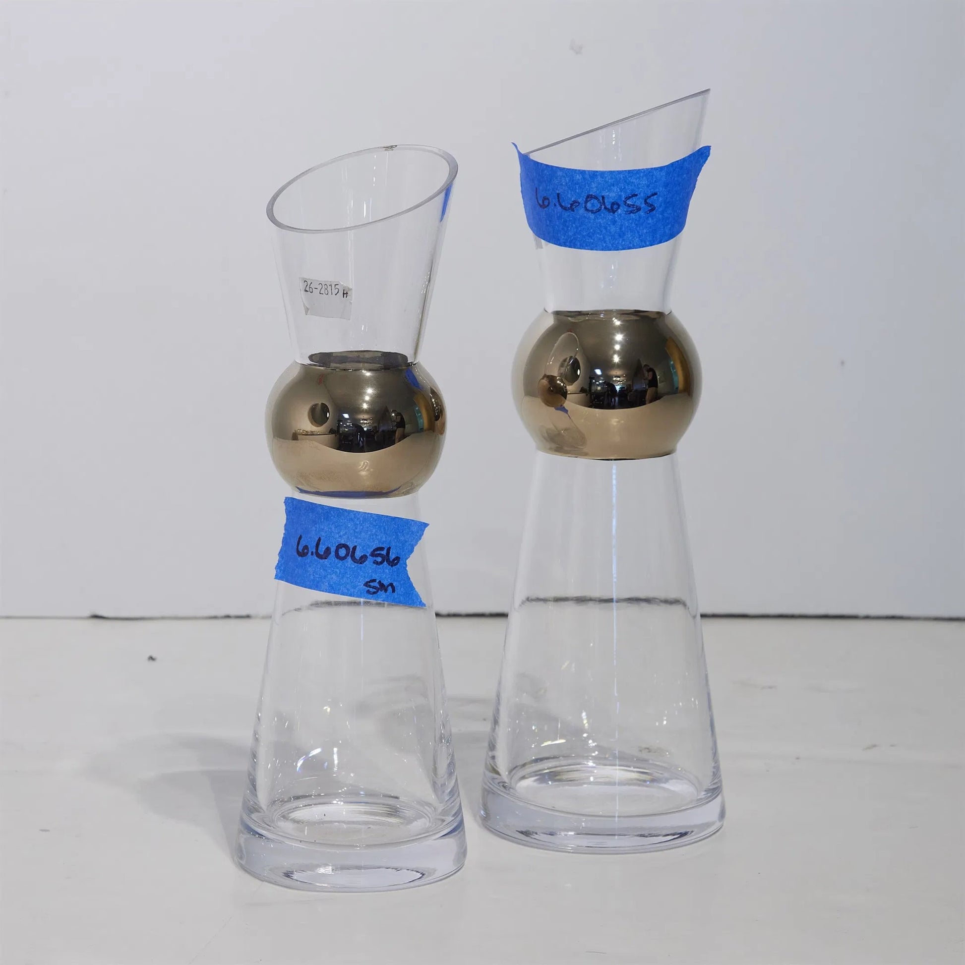 Metallic Orb Carafe by Global Views. Made from art glass in a eclectic & global style.