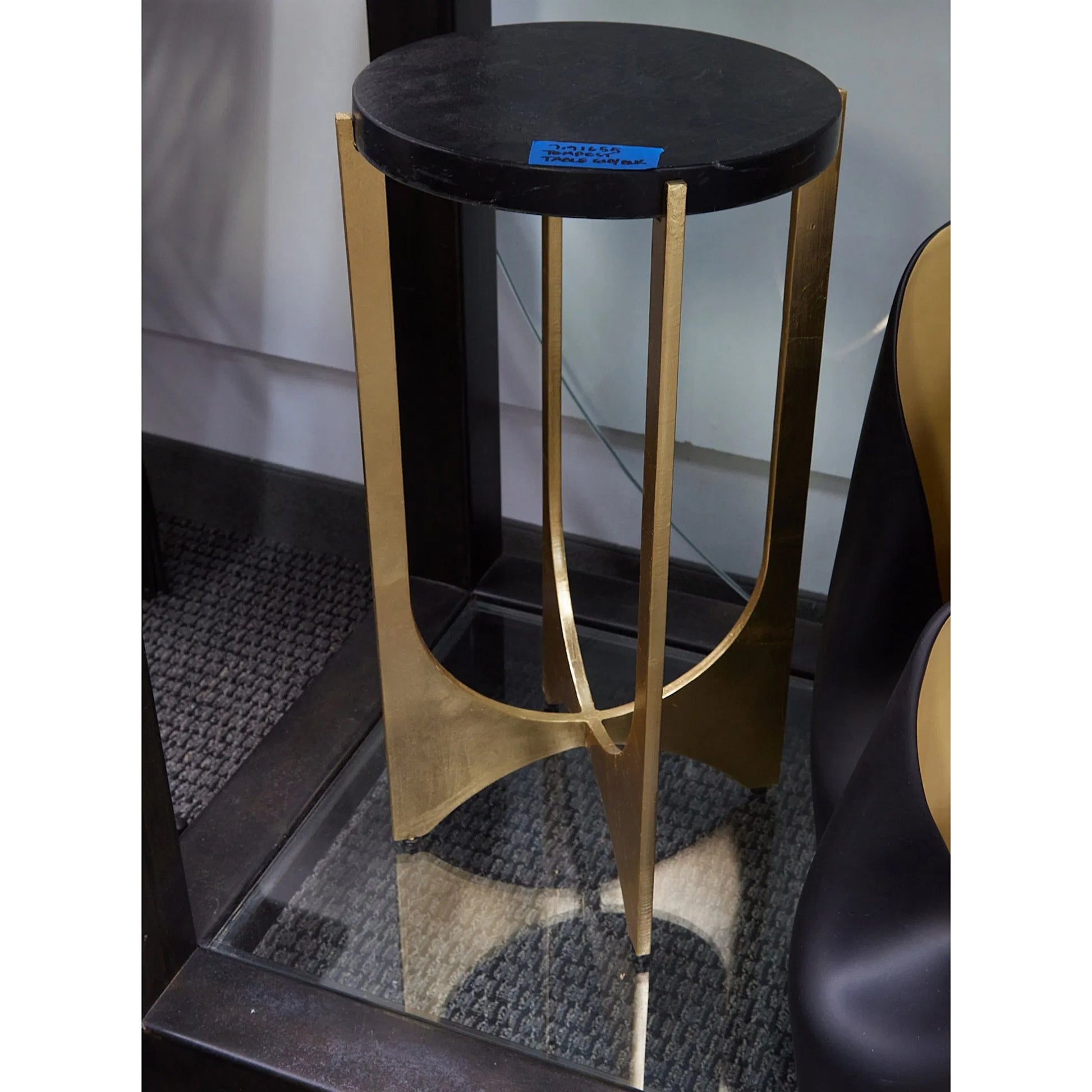 Tempest Table by Global Views in gold leaf. Made from iron, black marin leather marble in a unique style.