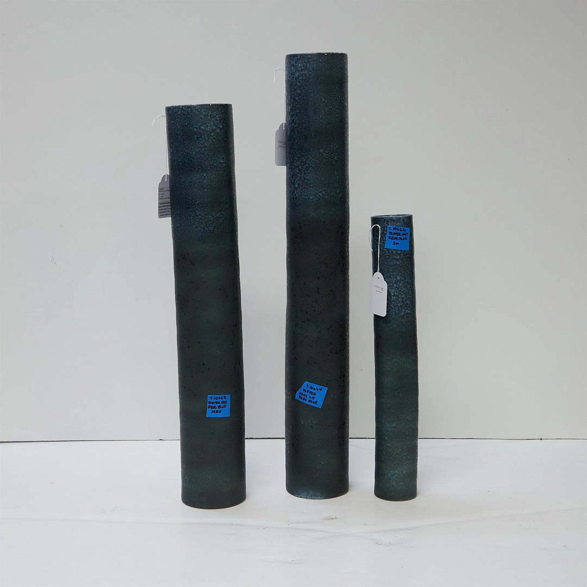 Teeter Vase by Global Views in reactive blue. Made from porcelain in a modern style.