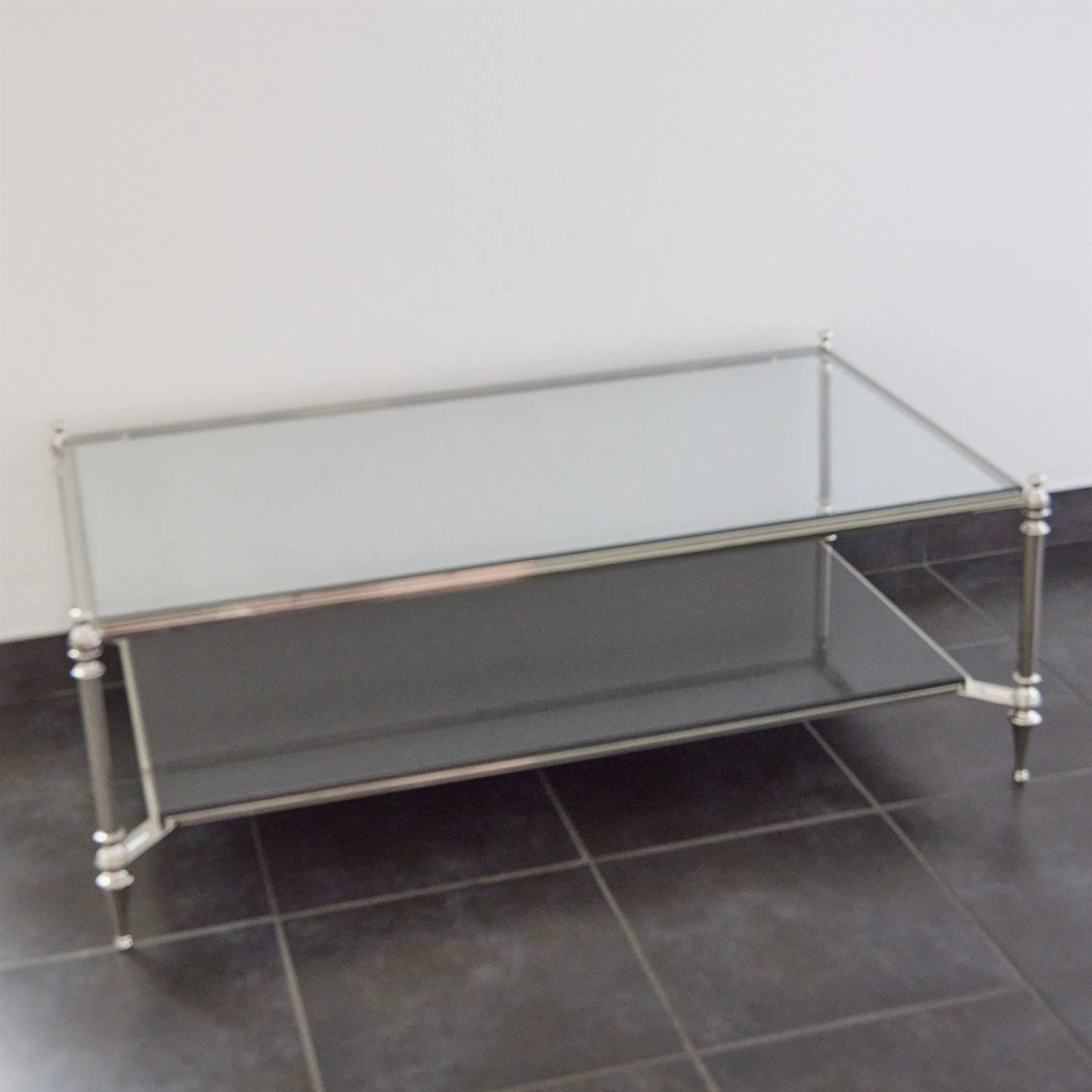 Medford Cocktail Table by Global Views in nickel. Made from brass, iron, stainless steel, glass, granite in a unique style.