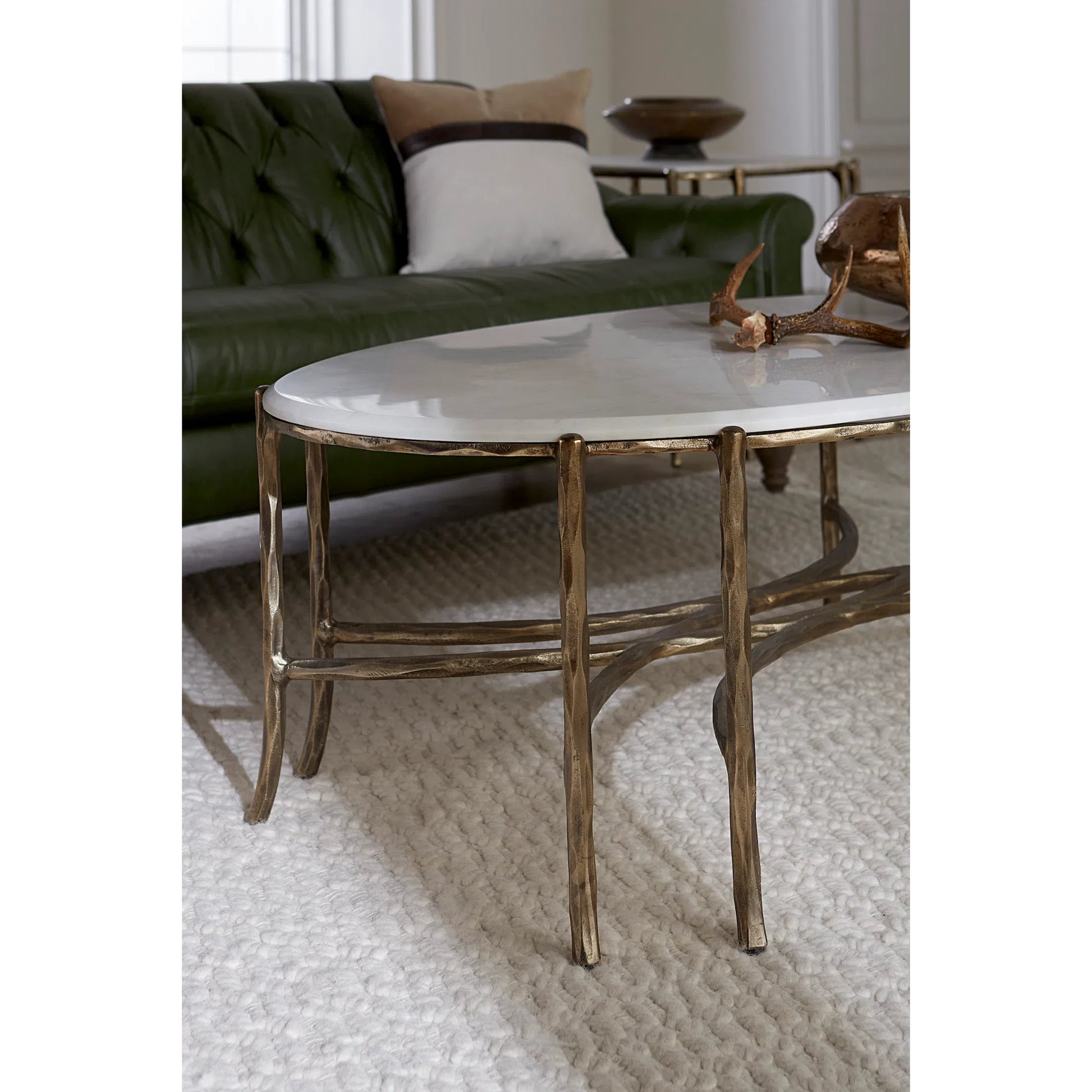 Monier Cocktail Table by Fairfield Chair in antique gold and antique gold. Made from faux, bois metal, calcutta stone in a unique style.