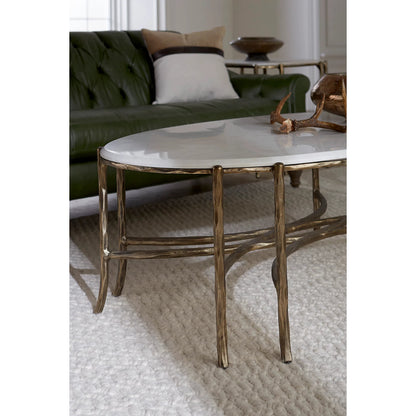 Monier Cocktail Table by Fairfield Chair in antique gold and antique gold. Made from faux, bois metal, calcutta stone in a unique style.