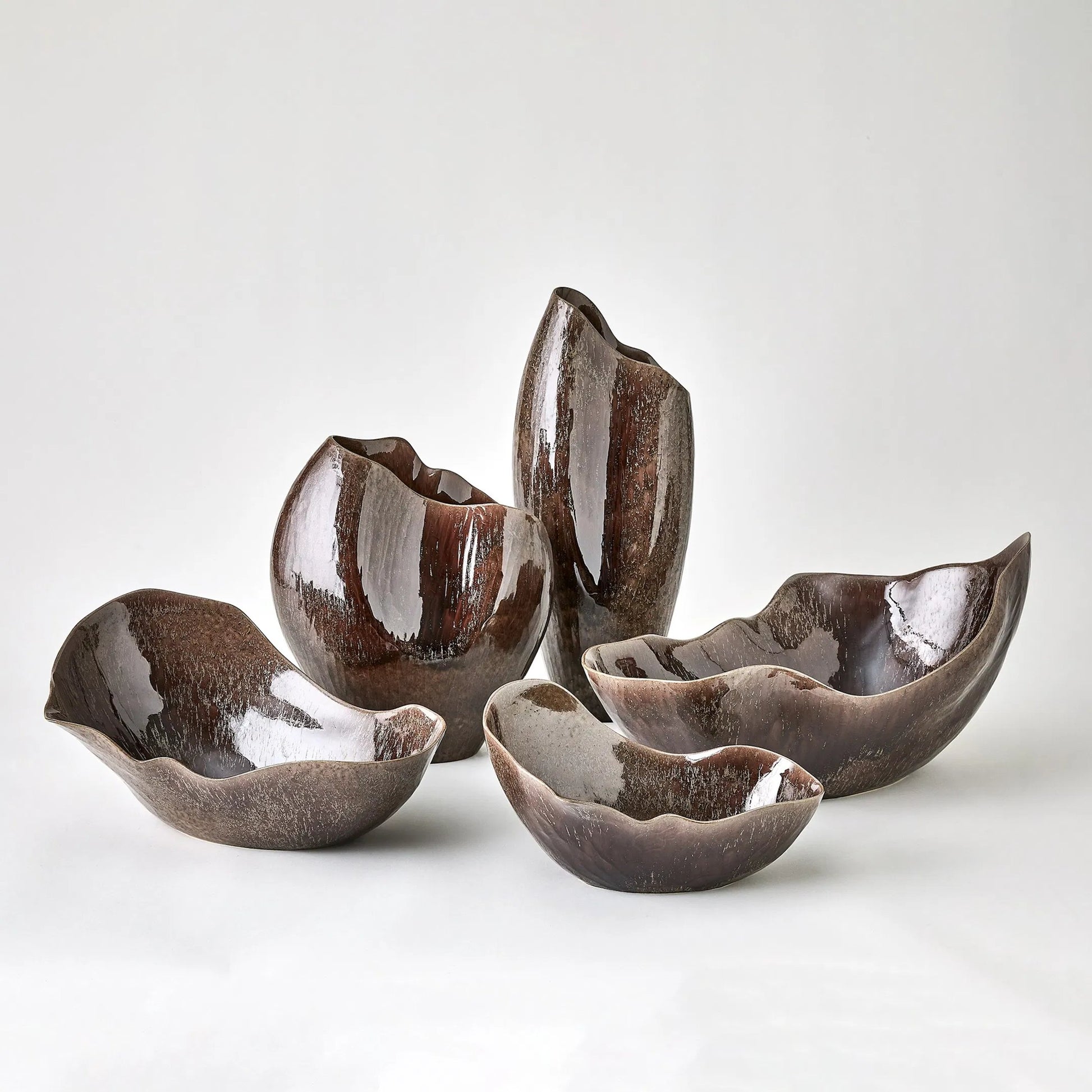 Horn Bowl, Reactive Amethyst by Global Views in reactive amethyst. Made from ceramic in a modern style.