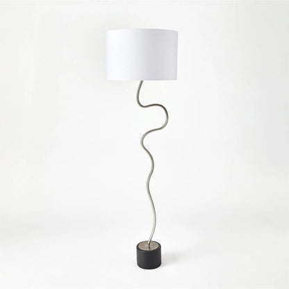 Loop Floor Lamp by Global Views in black, white, off-white, tan and brass. Made from unique in a unique style.
