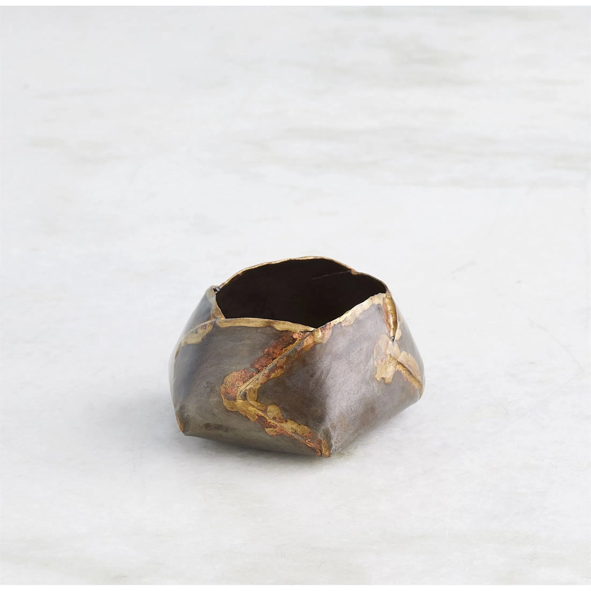 Pleated Armor Bowl by Global Views in antique gunmetal. Made from iron in a rustic style.
