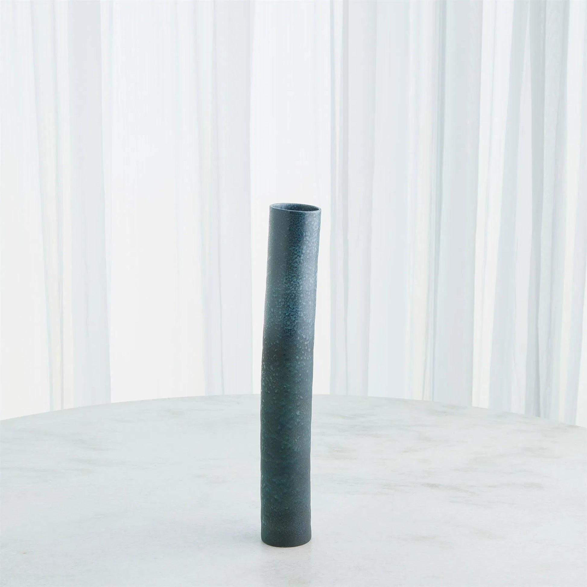 Teeter Vase by Global Views in reactive blue. Made from porcelain in a modern style.