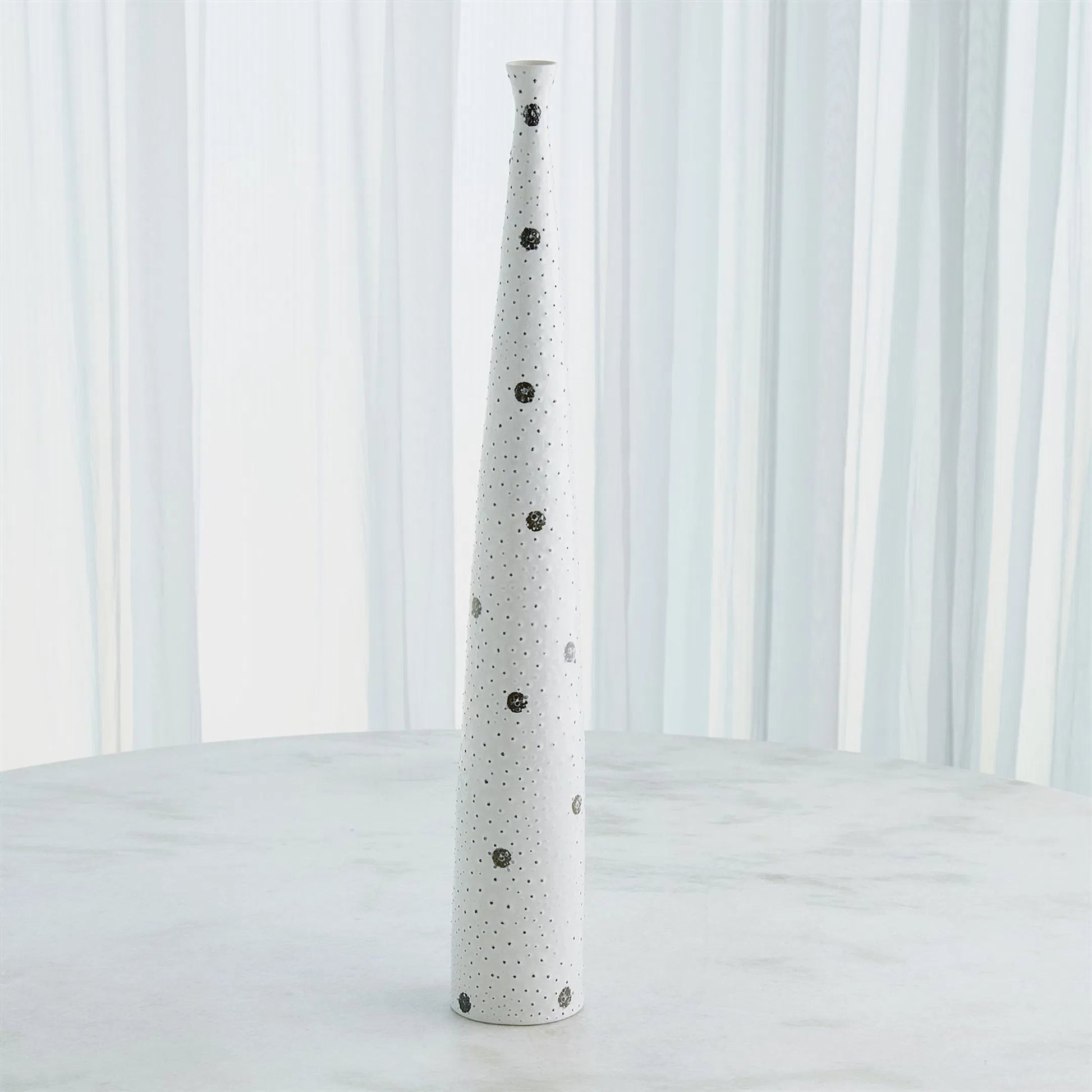 Spotted Tapered Vase by Global Views in white and black. Made from unique in a eclectic & global style.