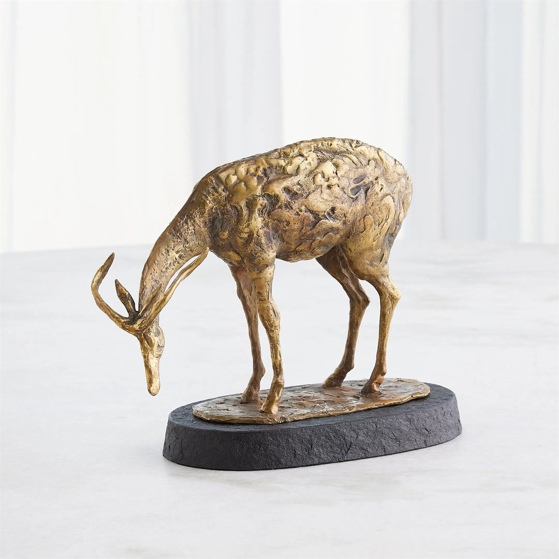 Nara Bowing Deer by Global Views in black and marble. Made from unique in a modern style.
