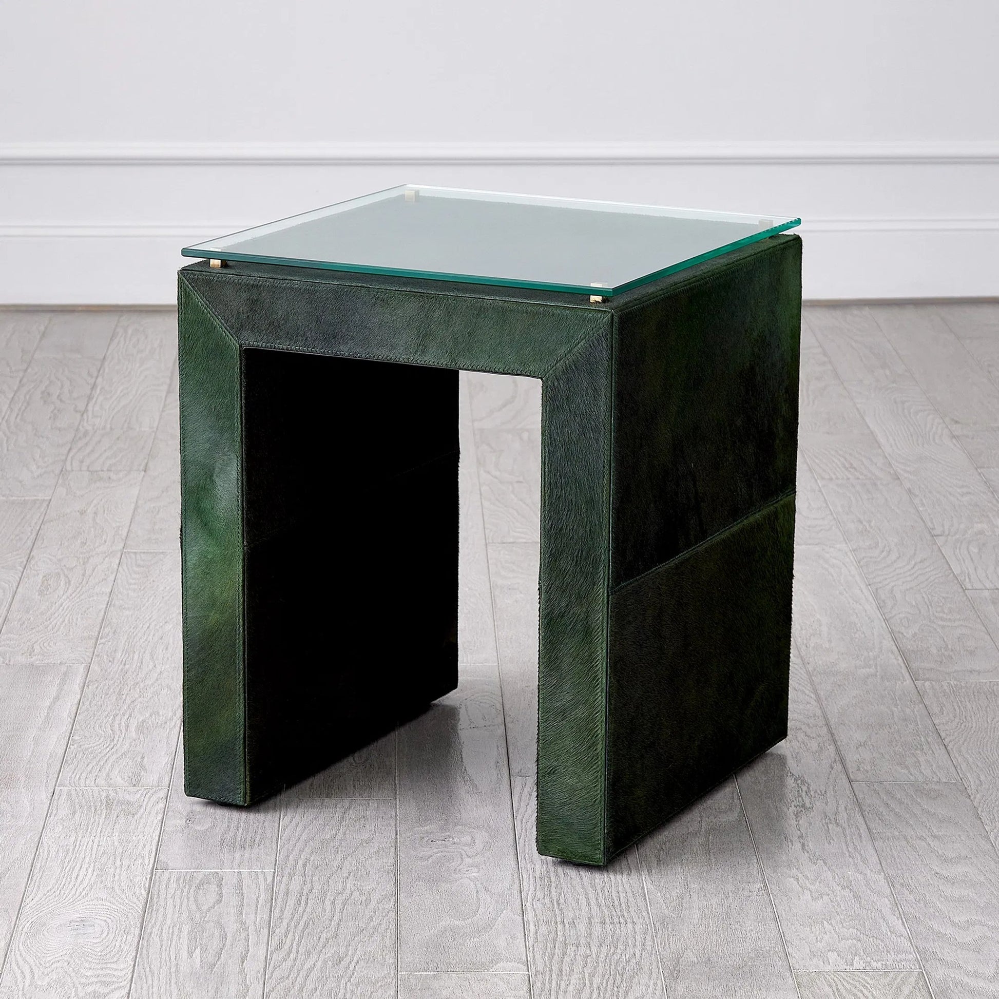 Posh Side Table by Global Views in hair. Made from mdf, hair on leather, brass, tempered glass in a unique style.