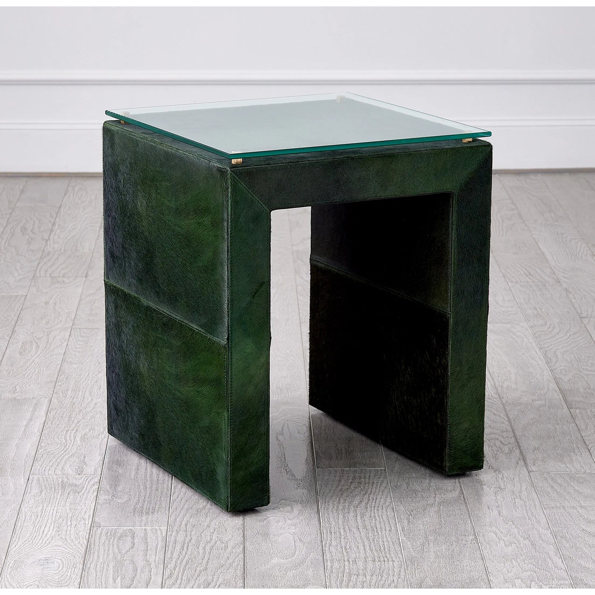 Posh Side Table by Global Views in hair. Made from mdf, hair on leather, brass, tempered glass in a unique style.