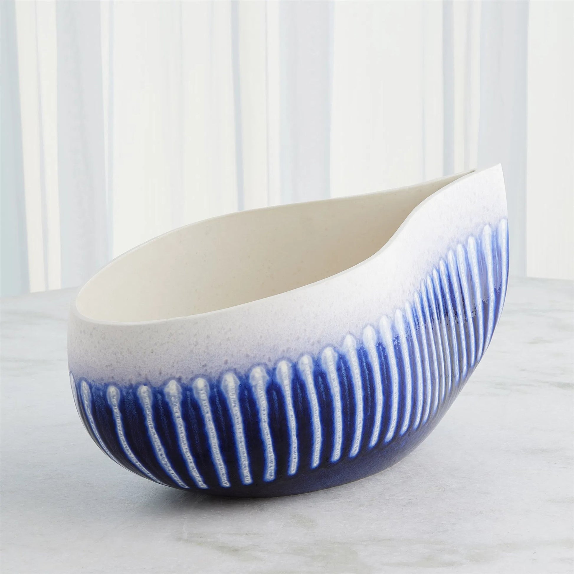 Giant Teardrop Bowl by Global Views. Made from ceramic in a unique style.