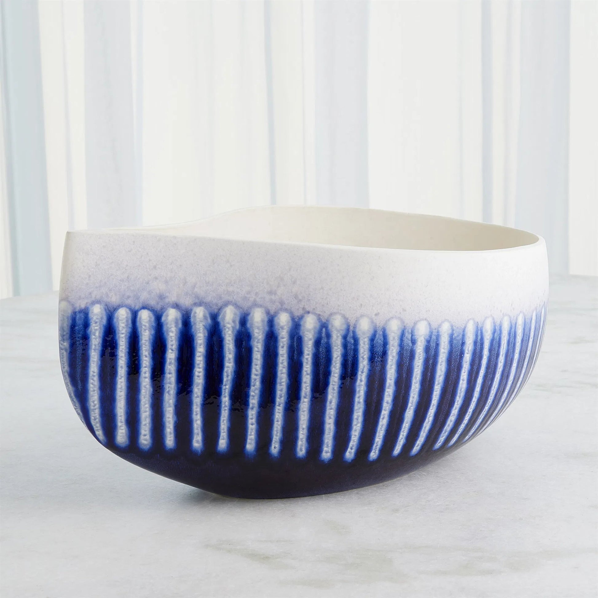 Giant Teardrop Bowl by Global Views. Made from ceramic in a unique style.