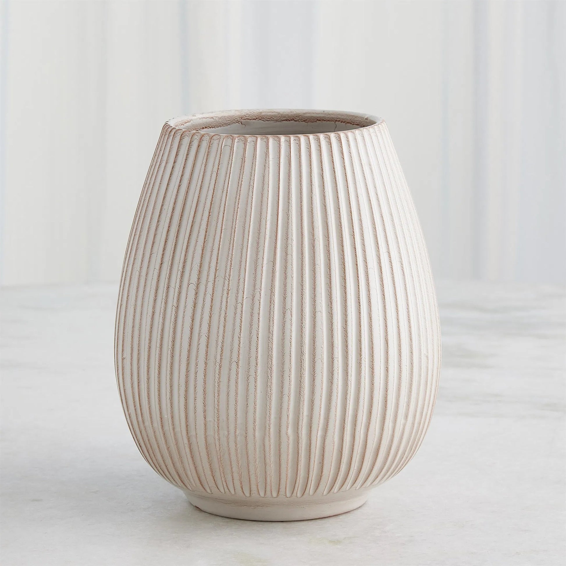 Vertical Ribbed Vase by Global Views in natural. Made from ceramic in a unique style.