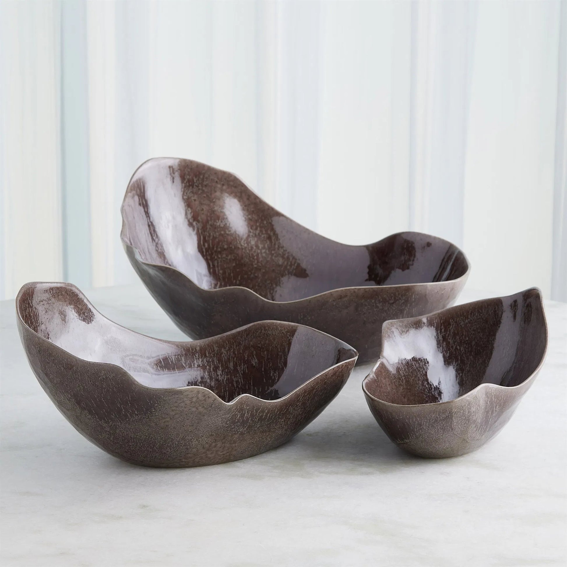 Horn Bowl, Reactive Amethyst by Global Views in reactive amethyst. Made from ceramic in a modern style.