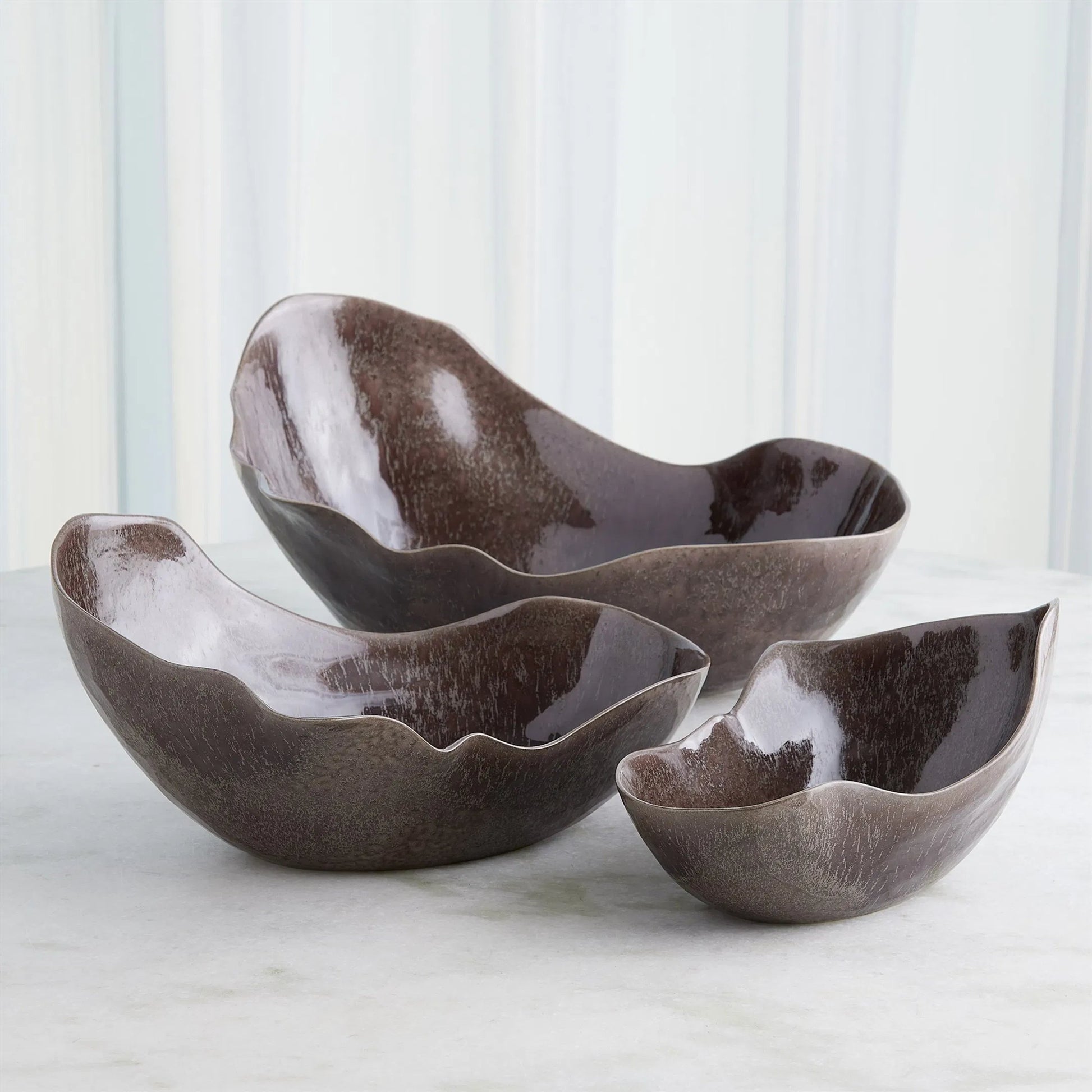 Horn Bowl, Reactive Amethyst by Global Views in reactive amethyst. Made from ceramic in a modern style.