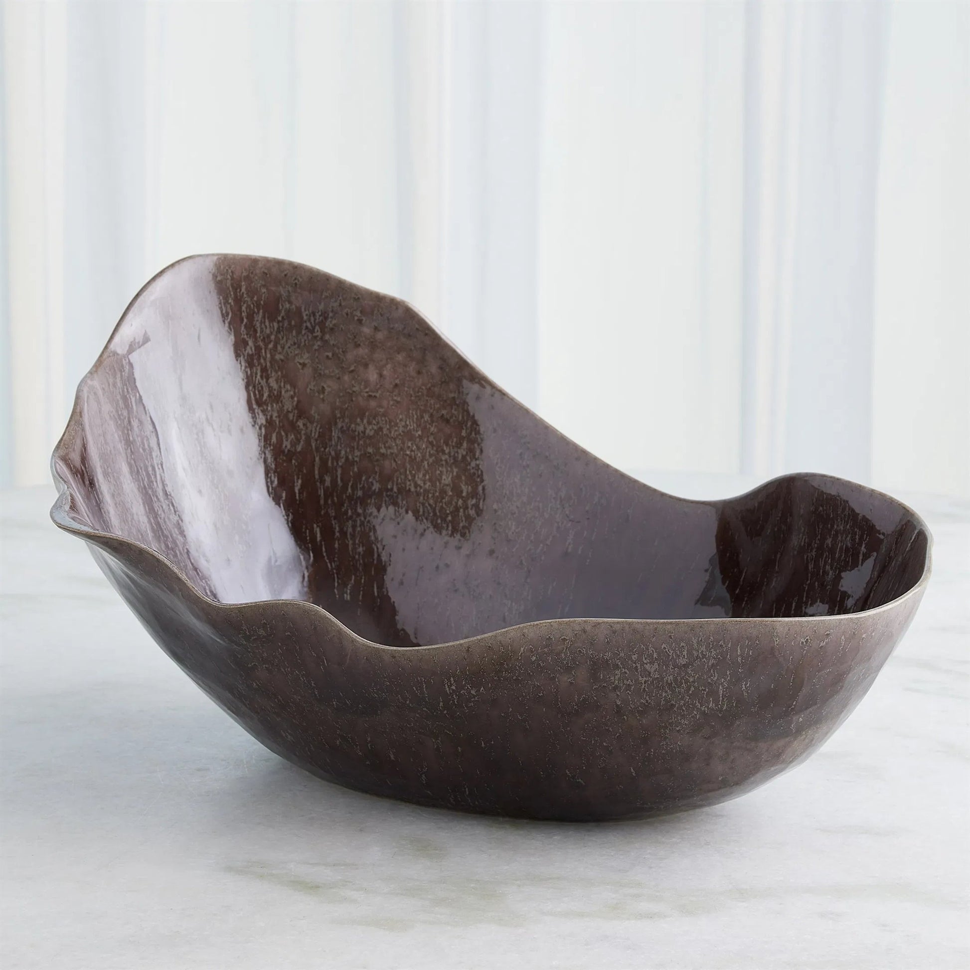 Horn Bowl, Reactive Amethyst by Global Views in reactive amethyst. Made from ceramic in a modern style.
